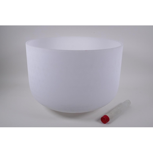 279 - A large crystal singing bowl with sand blasted exterior and polished interior, with fabric wrapped h... 