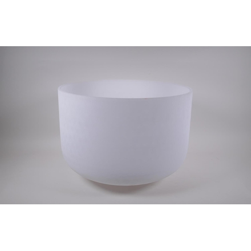 279 - A large crystal singing bowl with sand blasted exterior and polished interior, with fabric wrapped h... 