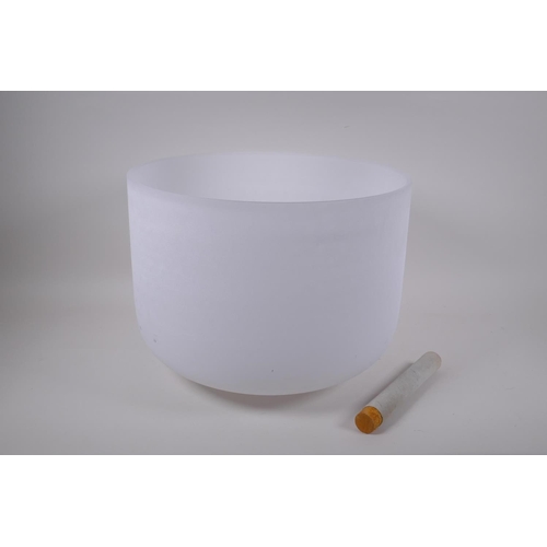 280 - A large crystal singing bowl with sand blasted exterior and polished interior, with fabric wrapped h... 