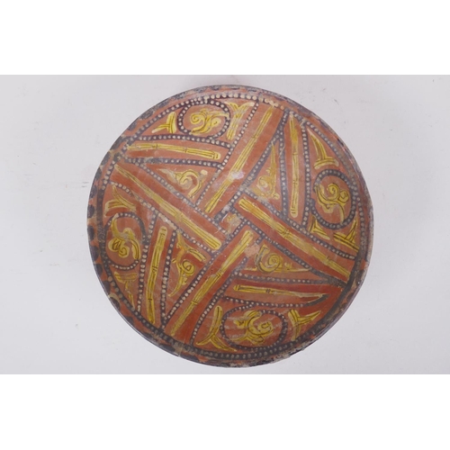 282 - An Islamic terracotta bowl decorated with a unique design, AF repairs, 23cm diameter