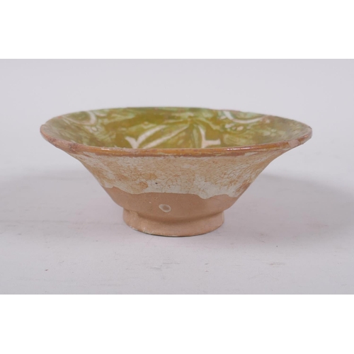 283 - A small middle eastern terracotta bowl with painted deer decoration, 11cm diameter