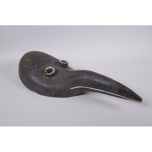 286 - An antique African painted wood mask, 46cm long