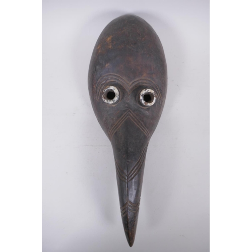 286 - An antique African painted wood mask, 46cm long