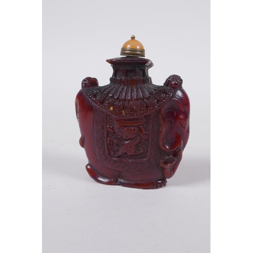 294 - A Chinese reverse decorated glass snuff bottle, a Canton enamel dragon snuff bottle, and a faux horn... 