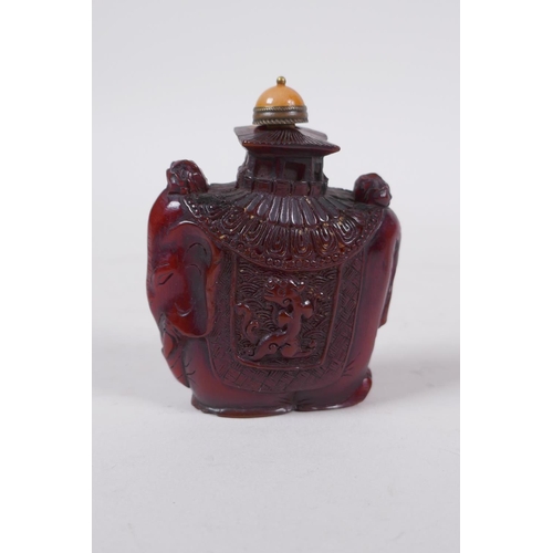 294 - A Chinese reverse decorated glass snuff bottle, a Canton enamel dragon snuff bottle, and a faux horn... 