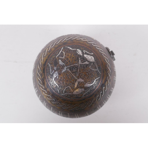 296 - An Islamic bronze ball shaped box with multi metal inlaid animal and script decoration, 11cm diamete... 