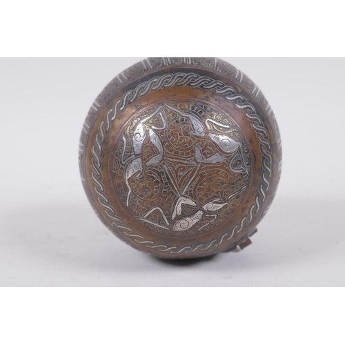 296 - An Islamic bronze ball shaped box with multi metal inlaid animal and script decoration, 11cm diamete... 