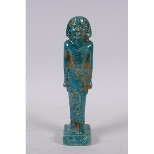 299 - An Egyptian faience turquoise glaze shabti, 21cm high