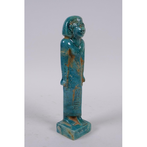 299 - An Egyptian faience turquoise glaze shabti, 21cm high