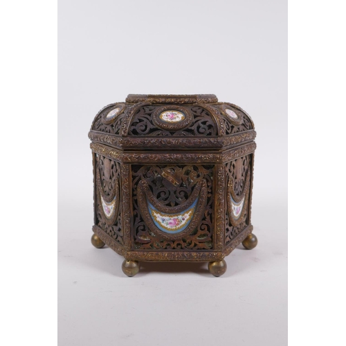 3 - A C19th French pierced ormolu jewellery casket of hexagonal form, with inset Sevres porcelain floral... 