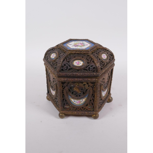 3 - A C19th French pierced ormolu jewellery casket of hexagonal form, with inset Sevres porcelain floral... 