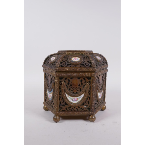 3 - A C19th French pierced ormolu jewellery casket of hexagonal form, with inset Sevres porcelain floral... 