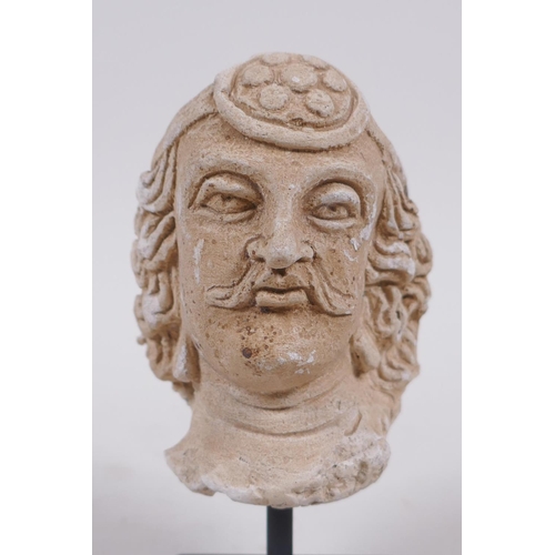 300 - A Gandahar style plaster bust of a gentleman, 13cm high