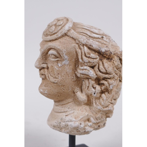 300 - A Gandahar style plaster bust of a gentleman, 13cm high