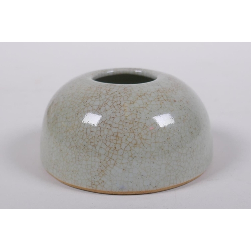 303 - A Chinese crackleware ink pot of domed form, 9cm diameter