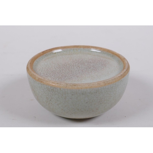 303 - A Chinese crackleware ink pot of domed form, 9cm diameter