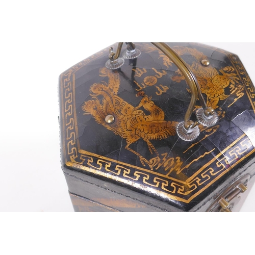 31 - A Chinese black lacquer caddy of hexagonal form with gilt chinoiserie decoration and brass mounts, 1... 