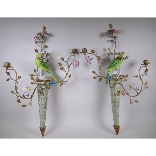 32 - A pair of two branch porcelain and gilt metal parrot wall sconces decorated in bright enamels, 52 x ... 