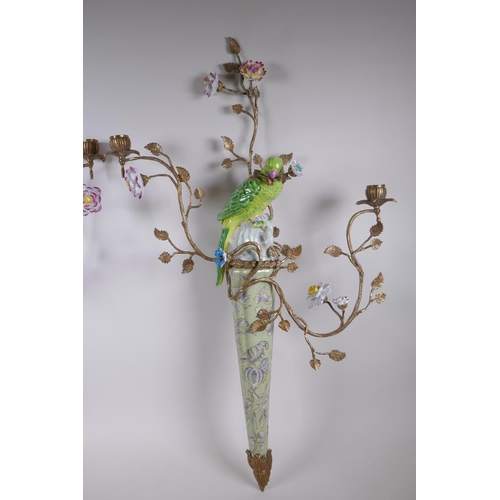 32 - A pair of two branch porcelain and gilt metal parrot wall sconces decorated in bright enamels, 52 x ... 