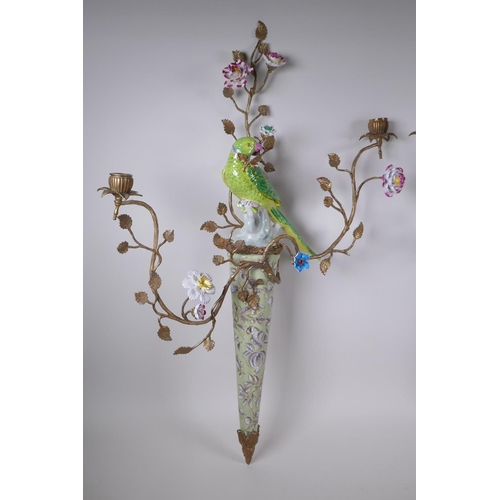 32 - A pair of two branch porcelain and gilt metal parrot wall sconces decorated in bright enamels, 52 x ... 