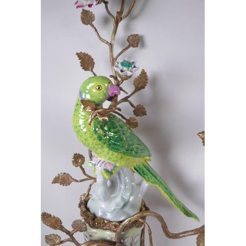 32 - A pair of two branch porcelain and gilt metal parrot wall sconces decorated in bright enamels, 52 x ... 