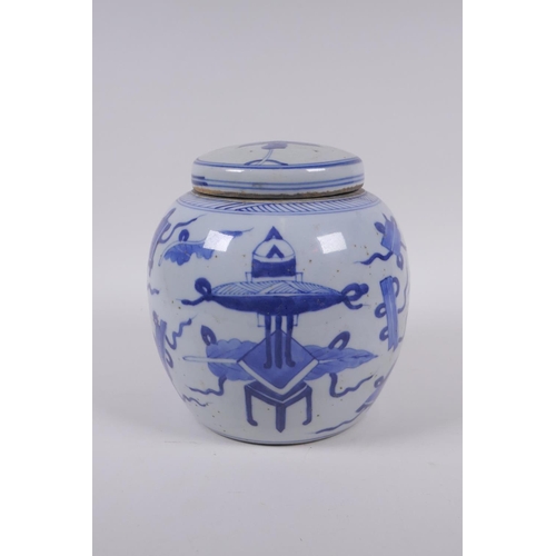 33 - A late C19th/early C20th Chinese blue and white porcelain ginger jar and cover, decorated with objec... 