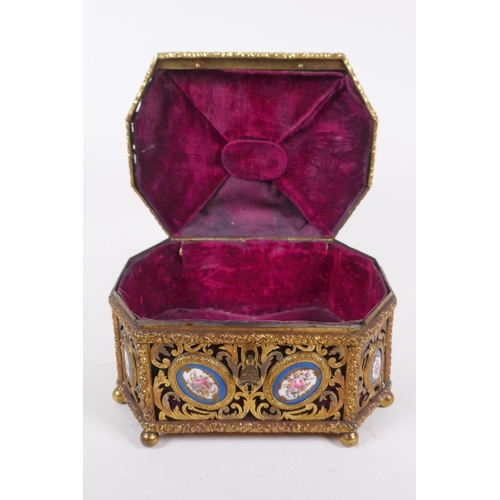 34 - A C19th French pierced ormolu jewellery casket with inset Sevres porcelain floral plaques and velvet... 