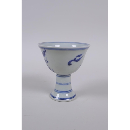 35 - A Chinese blue and white porcelain stem cup with dragon decoration, Xuande 6 character mark to base,... 