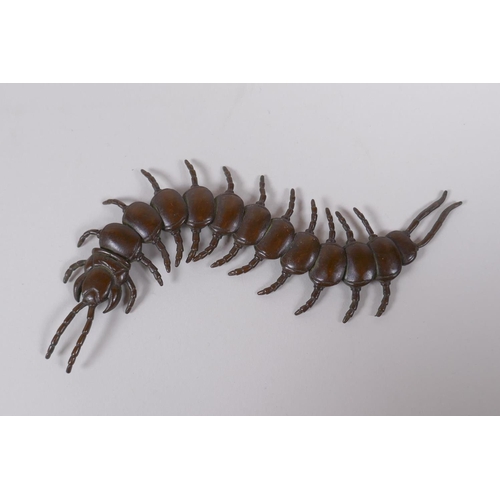 40 - A Japanese jizai style bronze okimono centipede with articulated segments, 15cm long