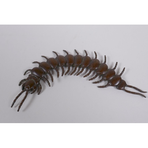 40 - A Japanese jizai style bronze okimono centipede with articulated segments, 15cm long