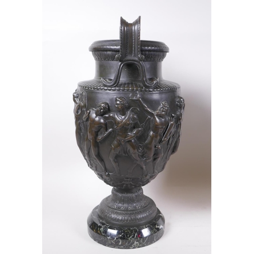 5 - A pair of Grand Tour bronze urns on marble bases, decorated with Greco Roman figures, 41cm high