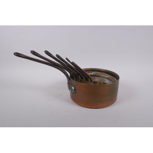 51 - A set of six graduated French copper sauce pans, largest 18cm diameter