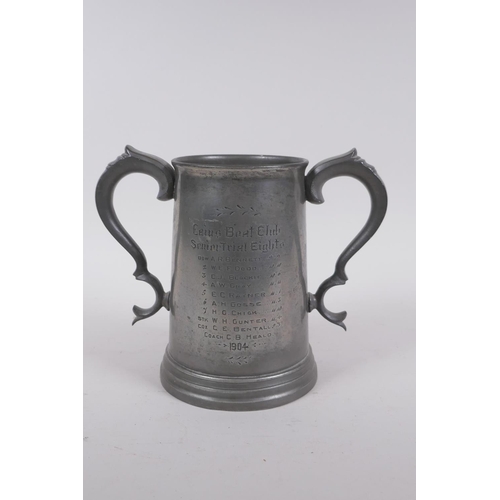 57 - An antique twin handled pewter trophy for the Cambridge Caius College boat club senior trial eights,... 