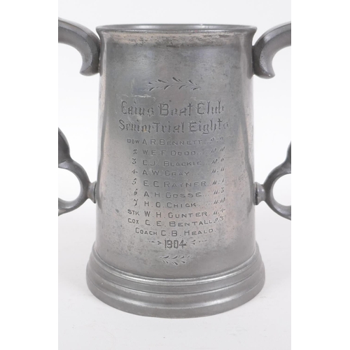 57 - An antique twin handled pewter trophy for the Cambridge Caius College boat club senior trial eights,... 