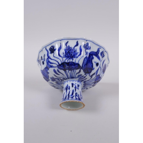 58 - A blue and white porcelain stem bowl of lobed form, decorated with carp in a lotus pond, Chinese Xua... 