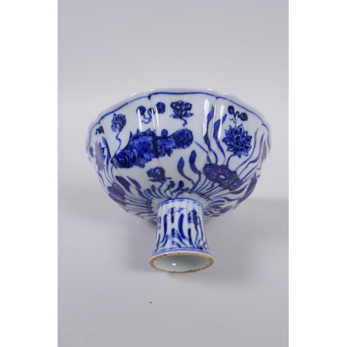 58 - A blue and white porcelain stem bowl of lobed form, decorated with carp in a lotus pond, Chinese Xua... 