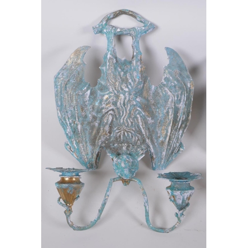 64 - A pair of gothic style bronze bat two branch sconces with extensive verdigris patina, 25 x 34cm