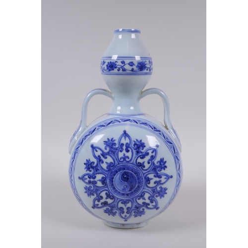 68 - A blue and white porcelain garlic head shaped flask with two handles and Yin Yang decoration, Chines... 