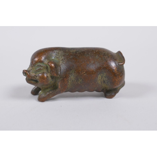 70 - A Japanese style bronze okimono pig, 6cm long