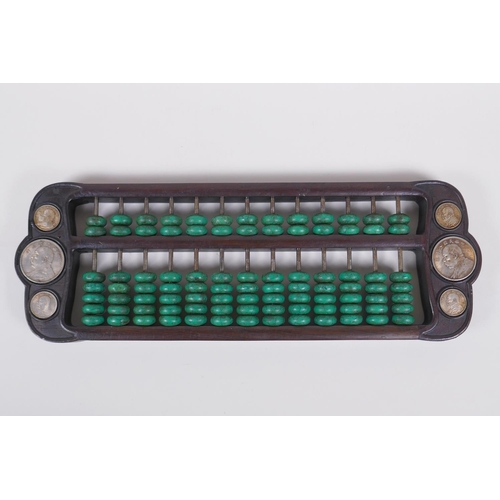 71 - A Chinese hardwood and malachite style stone abacus inset with white metal tokens, 41 x 15cm