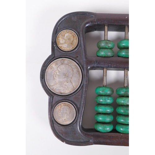 71 - A Chinese hardwood and malachite style stone abacus inset with white metal tokens, 41 x 15cm