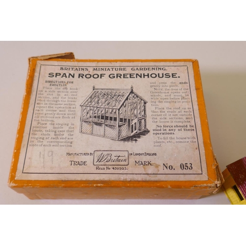 74 - A Britains Miniature Gardening Span Roof Greenhouse, in original box, AF minor loss to one end, and ... 