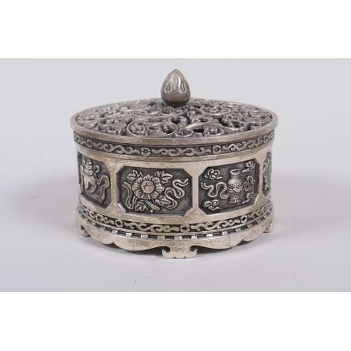 75 - A Sino Tibetan white metal cylinder censer and cover, decorated with the emblems of the eight immort... 