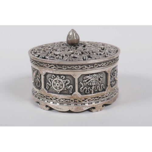 75 - A Sino Tibetan white metal cylinder censer and cover, decorated with the emblems of the eight immort... 