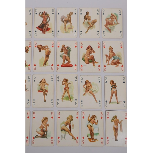 79 - A collection of assorted retro Playboy collectors' cards, and a set of pin-up playing cards, 6 x 9cm