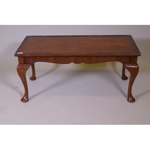 1149 - A Queen Anne style coffee table with figured walnut top and inset glass, labelled H. Shaw, London, 9... 