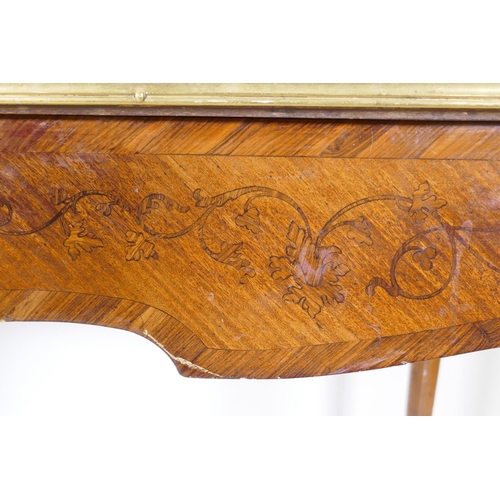 1002 - A French marquetry inlaid bureau plat, with shaped top, single drawer and ormolu mounts, bears label... 