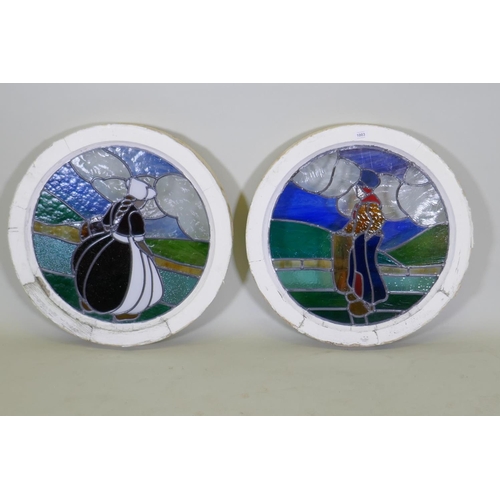 1003 - A pair of pine framed round window with stained glass depicting a Dutch boy and girl, 60cm diameter