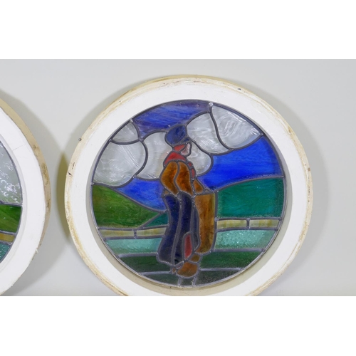 1003 - A pair of pine framed round window with stained glass depicting a Dutch boy and girl, 60cm diameter