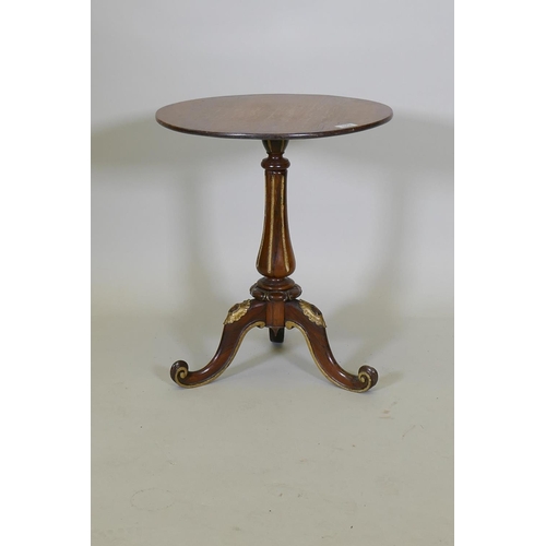 1004 - A Regency rosewood wine table, with parcel gilt decoration, raised on a carved and fluted column and... 